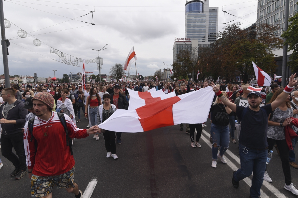 People carry a flag in 