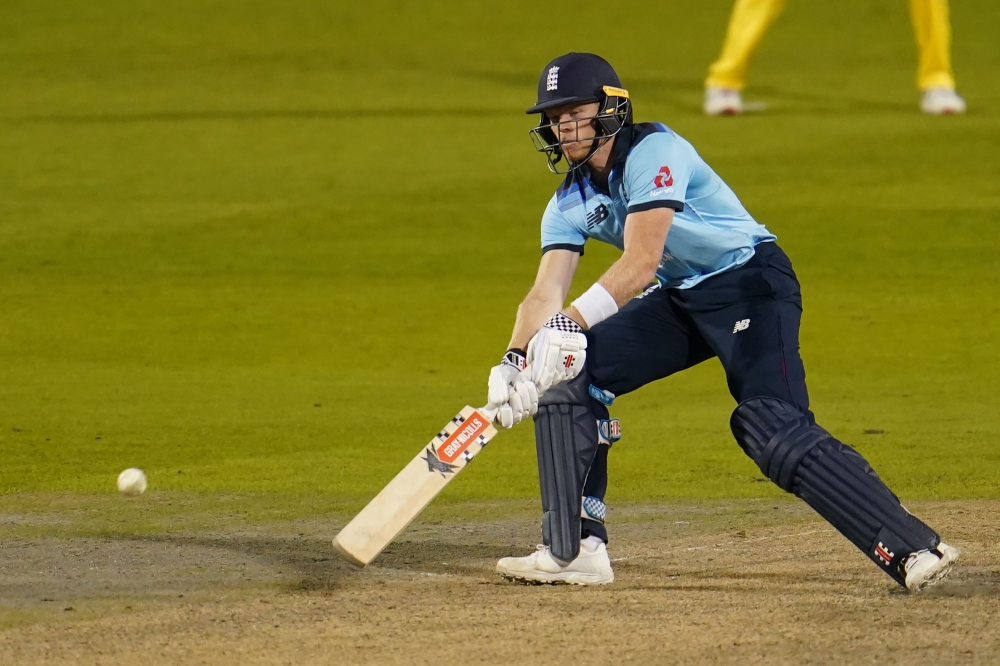 England's Sam Billings plays a ramp shot during the one-day international (ODI) cricket match between England and Australia at Old Trafford in Manchester on September 11, 2020. (AFP / POOL / Jon Super)