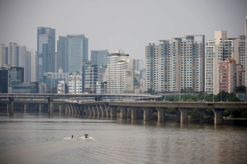 A man enjoys wakeboard amid the coronavirus disease (COVID-19) pandemic at a Han River park in Seoul, South Korea, Sept. 10, 2020. REUTERS/Kim Hong-Ji/File Photo