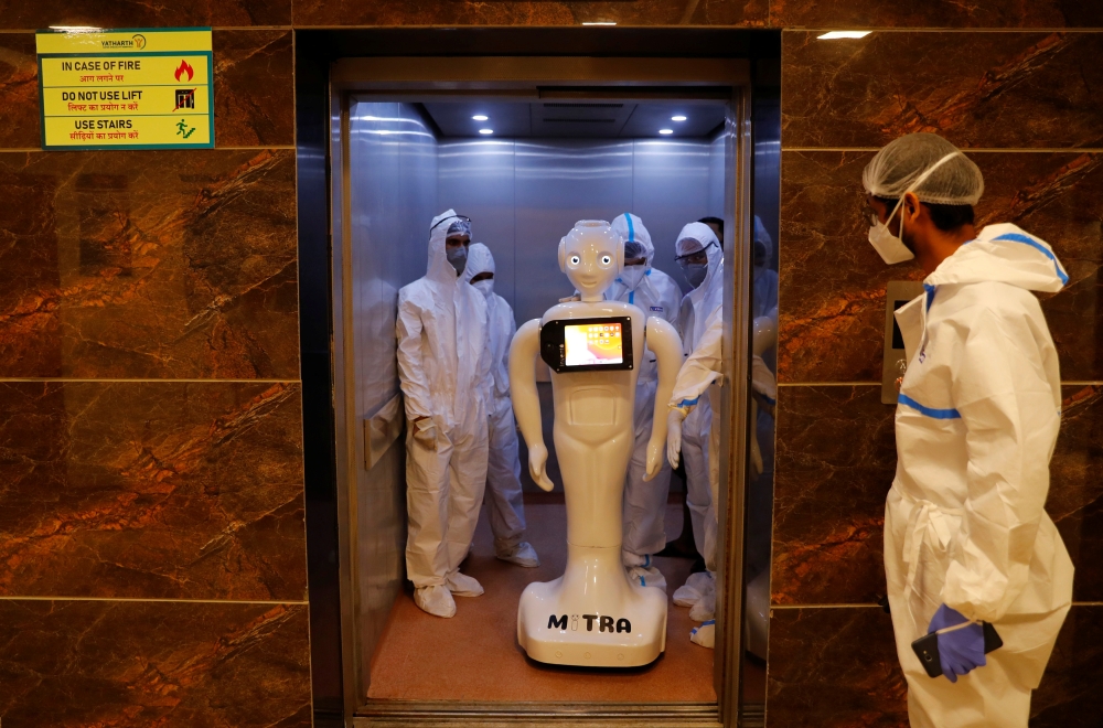 A robot named 'Mitra', which is used by the patients suffering from the coronavirus disease (COVID-19) to communicate with their relatives, is seen inside a lift of the Yatharth Super Speciality Hospital in Noida, on the outskirts of New Delhi, India, Sep
