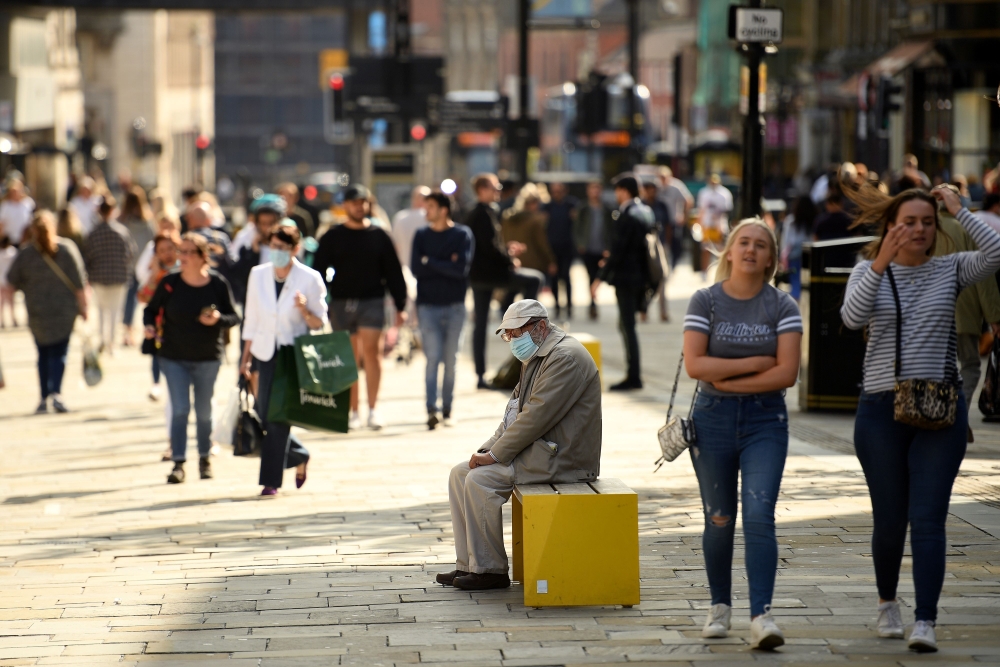 Shoppers, some wearing a face mask or covering due to the COVID-19 pandemic, walk in Newcastle city centre, north-east England, on September 17, 2020. AFP / Oli SCARFF
