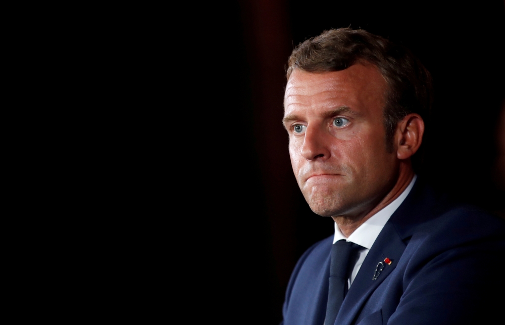 French President Emmanuel Macron looks on as he attends a news conference at the Pine Residence, the official residence of the French ambassador to Lebanon, in Beirut, Lebanon September 1, 2020. REUTERS/Gonzalo Fuentes/Pool/File Photo