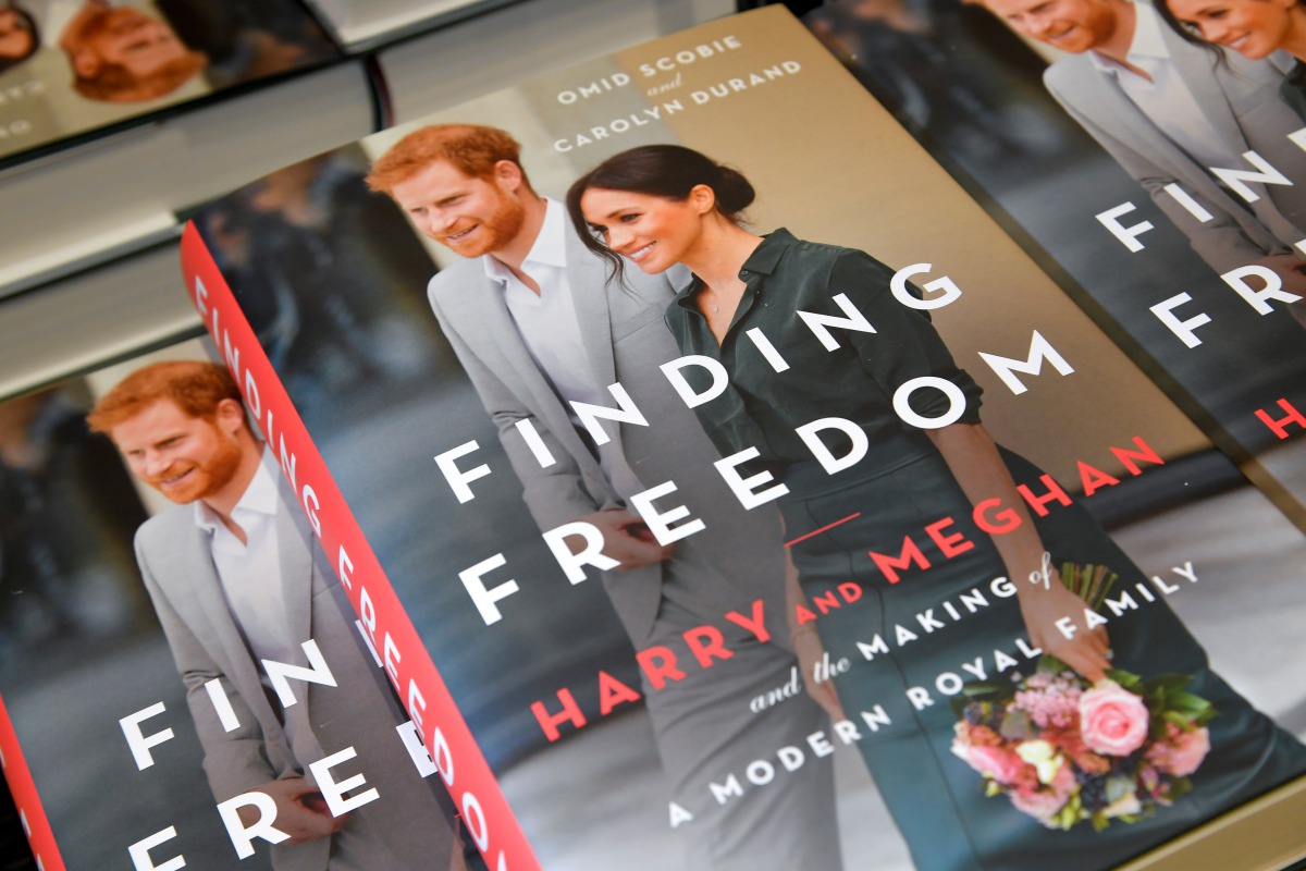 FILE PHOTO: Copies of 'Finding Freedom', an unofficial biography on Prince Harry and Meghan Markle, the Duke and Duchess of Sussex, are seen on display at a Waterstones bookshop in London, Britain August 12, 2020. REUTERS/Toby Melville/File Photo
