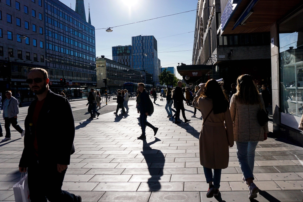 People walk in Stockholm on September 19, 2020, during the novel coronavirus COVID-19 pandemic. / AFP / Jonathan NACKSTRAND