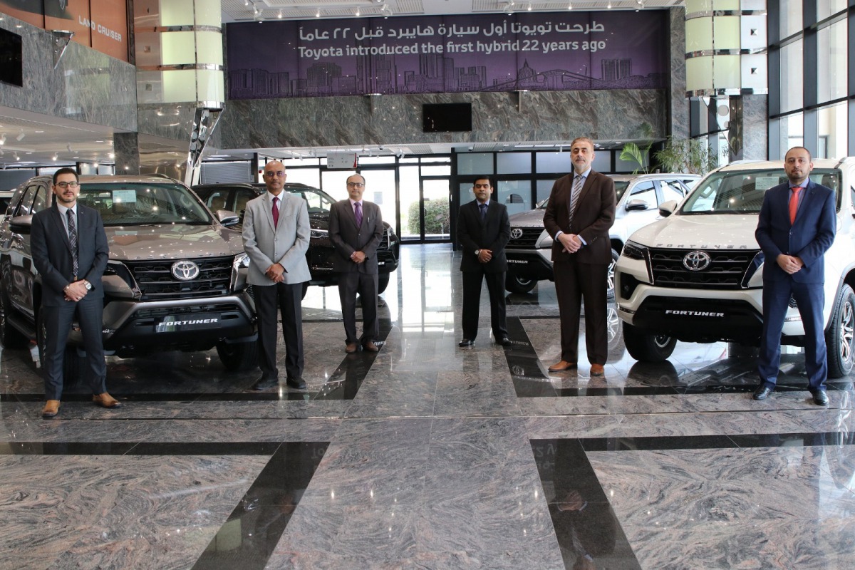 Senior officials of AAB posing for a picture with new Toyota Fortuner 2020 model cars.