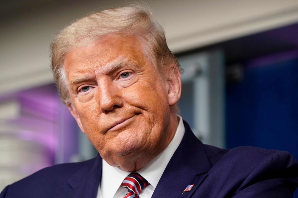 US President Donald Trump reacts to a question during a news conference in the Briefing Room of the White House on September 27, 2020 in Washington, DC. Joshua Roberts/Getty Images/AFP 