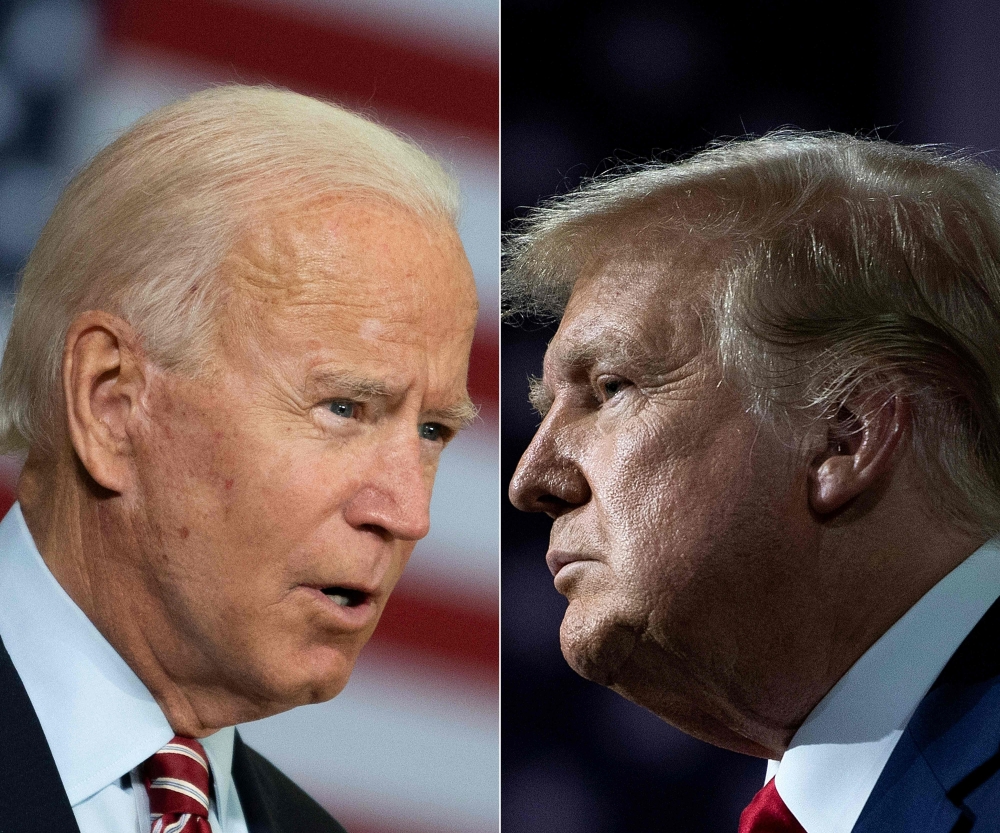 TOPSHOT - (COMBO) This combination of file pictures created on September 28, 2020 shows Democratic presidential candidate Joe Biden(L) speaking in Tampa, Florida on September 15, 2020 and US President Donald Trump speaking during an event for black suppor