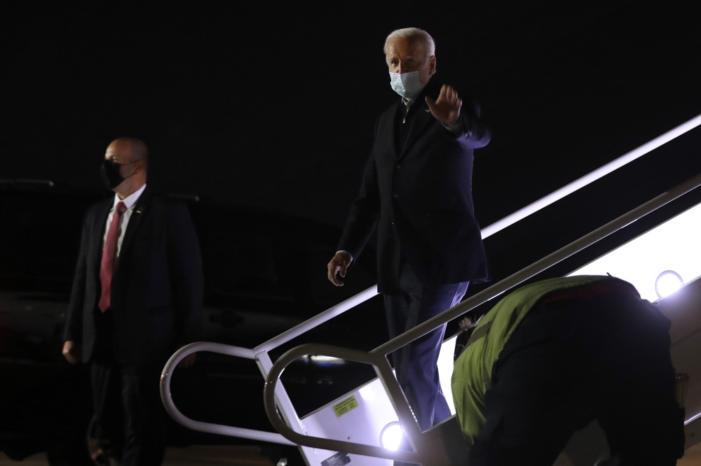 Democratic presidential nominee Joe Biden steps off of his campaign airplane after returning from Grand Rapids, Michigan, at New Castle County Airport October 2, 2020 in New Castle, Delaware. Chip Somodevilla/AFP