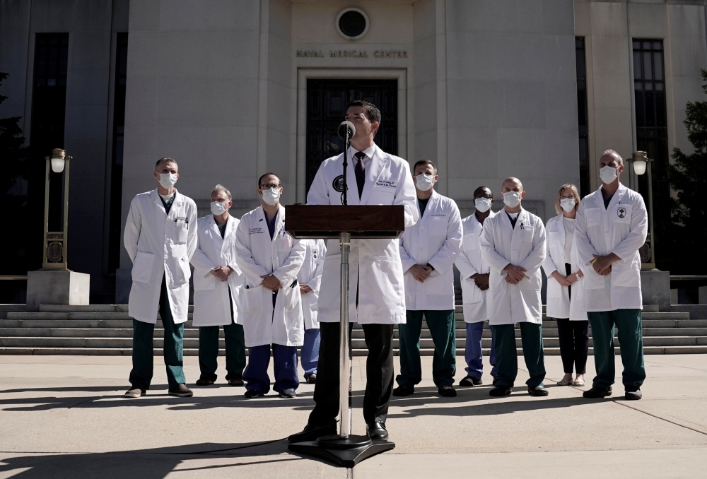 U.S. Navy Commander Dr. Sean Conley, the White House physician, talks to the media about U.S. President Donald Trump's health after the president was hospitalized for coronavirus disease (COVID-19) treatment, at Walter Reed National Military Medical Cente