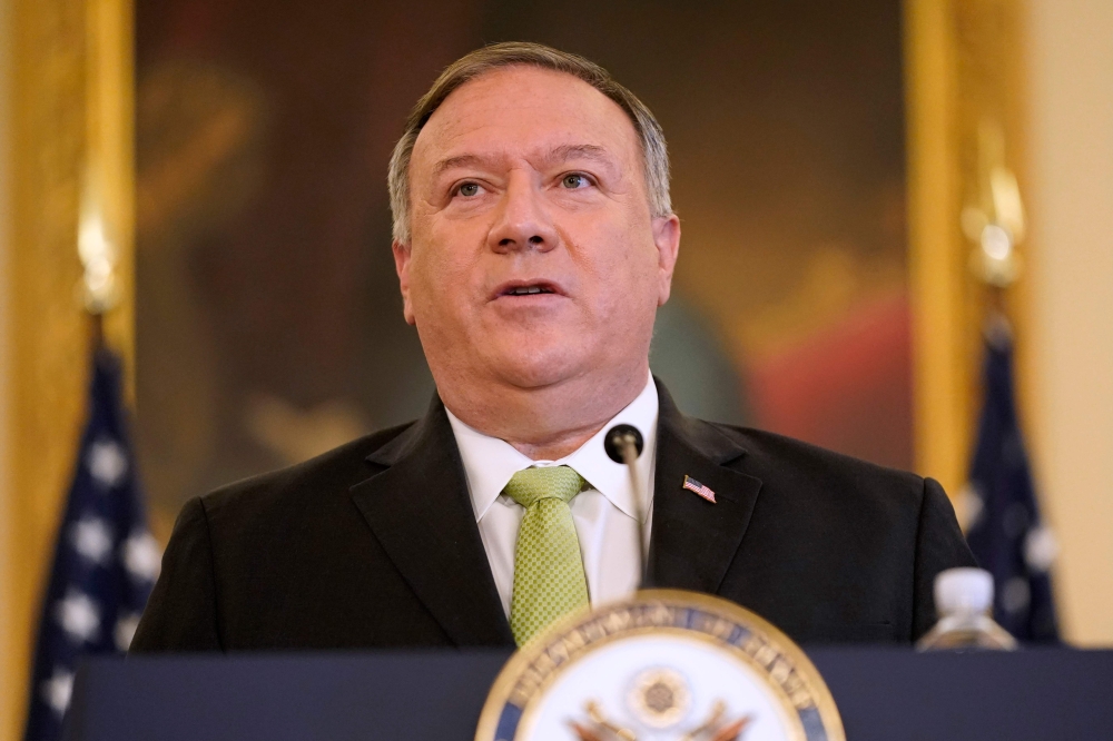 In this file photo taken on September 21, 2020 US Secretary of State Mike Pompeo speaks during a news conference to announce the Trump administration's restoration of sanctions on Iran, at the US State Department in Washington,DC. US Secretary of State Mi