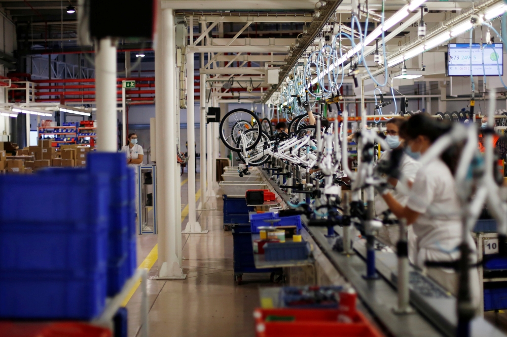 Workers are seen in RTE bicycles factory in Vila Nova de Gaia, Portugal, September 25, 2020. Picture taken September 25, 2020. REUTERS/Pedro Nunes