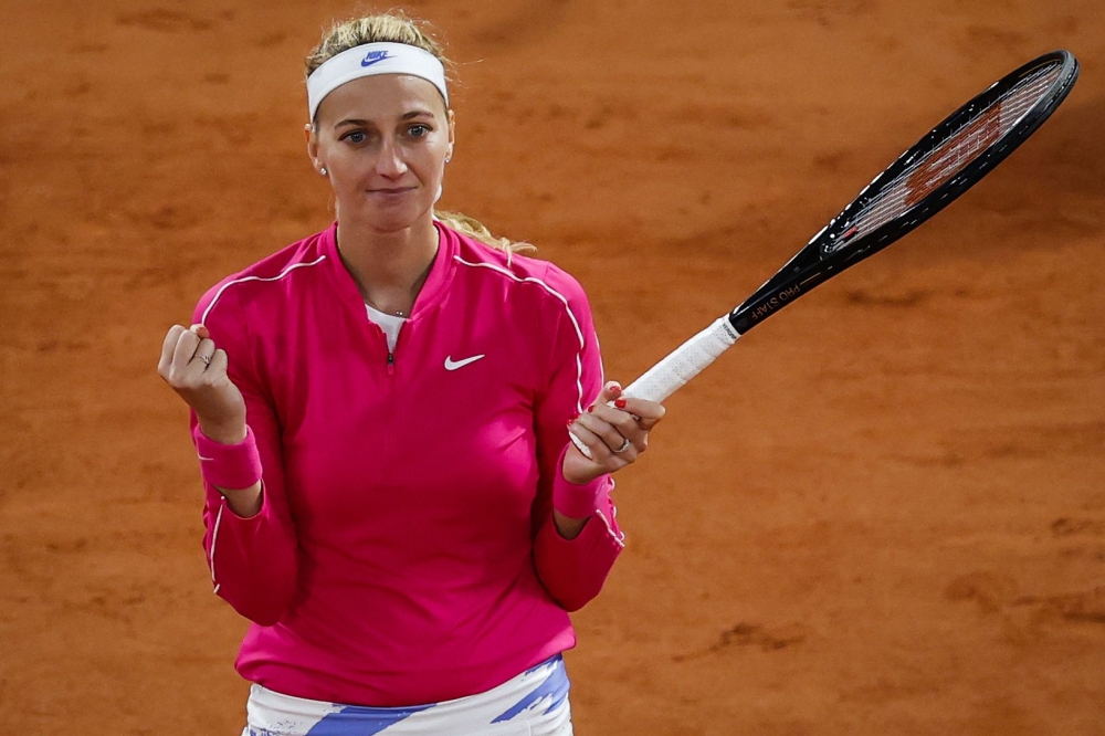 Czech Republic's Petra Kvitova celebrates after winning against China's Zhang Shuai during their women's singles fourth round tennis match on Day 9 of The Roland Garros 2020 French Open tennis tournament in Paris on October 5, 2020. / AFP / Thomas SAMSON