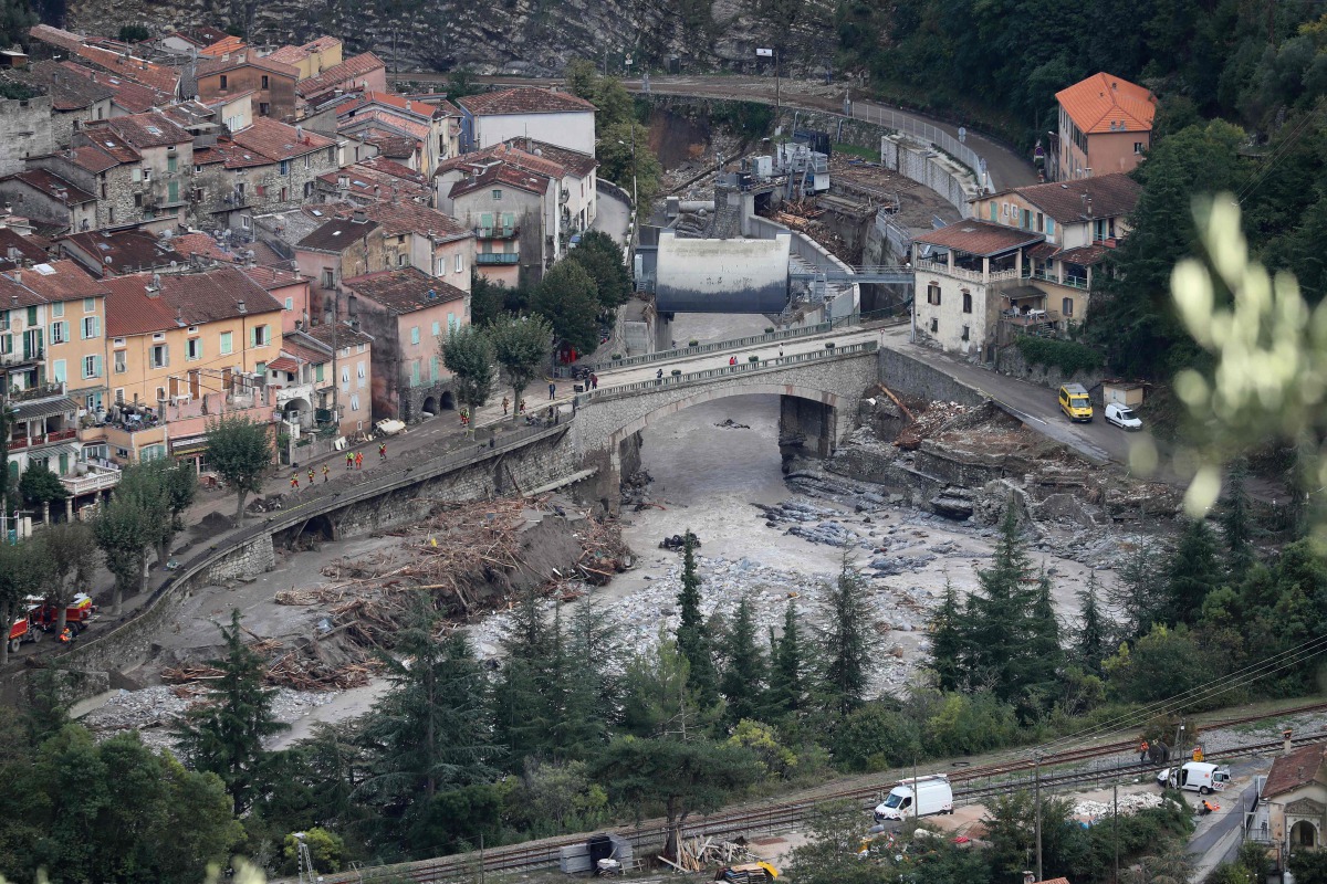 A picture taken on October 5, 2020 shows an aerial view of Breil-sur-Roya, a French village close to the Italian border, where houses were buried in mud and turned-over cars were stuck in the riverbed following heavy rains and floods. / AFP / Valery HACHE