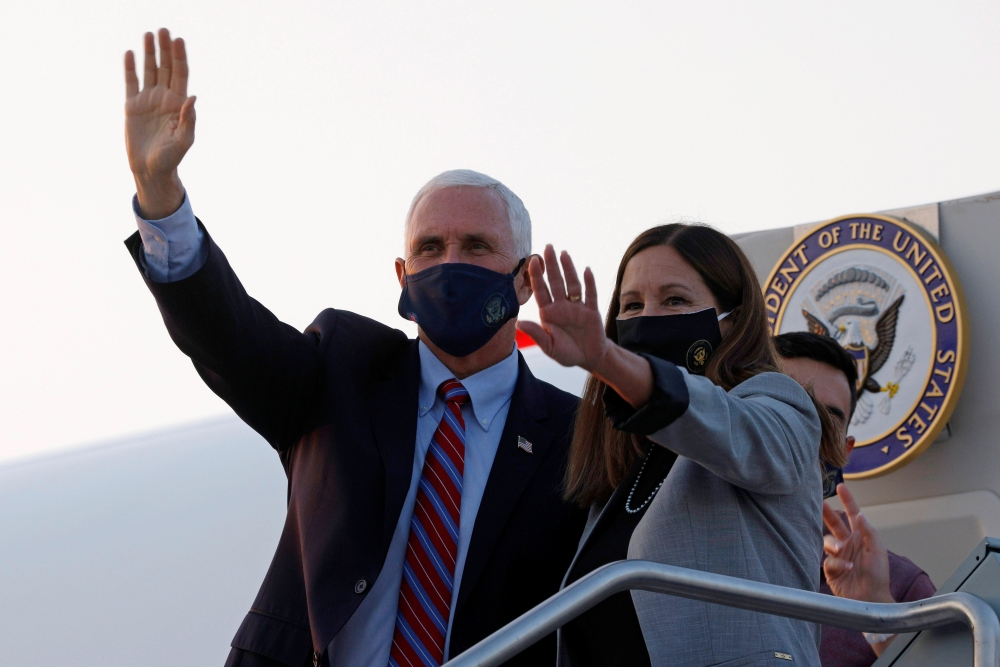 U.S. Vice President Mike Pence and his wife Karen arrive ahead of the vice presidential debate in Salt Lake City, Utah, U.S., October 5, 2020. REUTERS/Brian Snyder