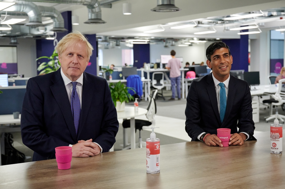 Britain's Prime Minister Boris Johnson and Britain's Chancellor of the Exchequer Rishi Sunak visit the headquarters of Octopus Energy, in London, Britain October 5, 2020. Leon Neal/Pool via Reuters 