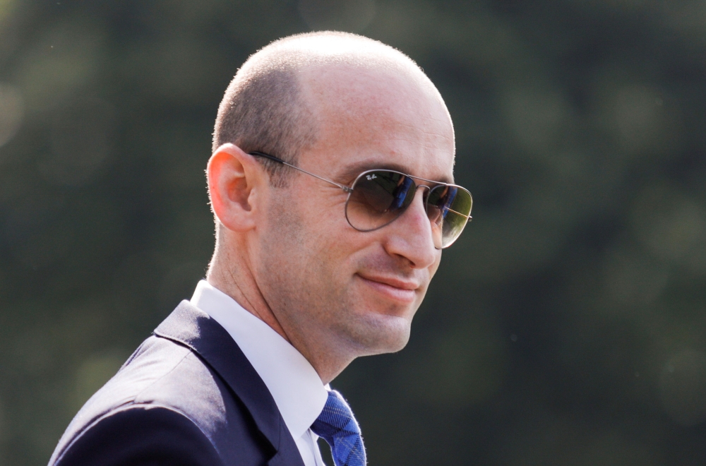 White House senior adviser Stephen Miller accompanies U.S. President Donald Trump to the Marine One helicopter while heading out on a day trip to Arizona and a visit to the U.S.-Mexico border, departing from the South Lawn of the White House in Washington