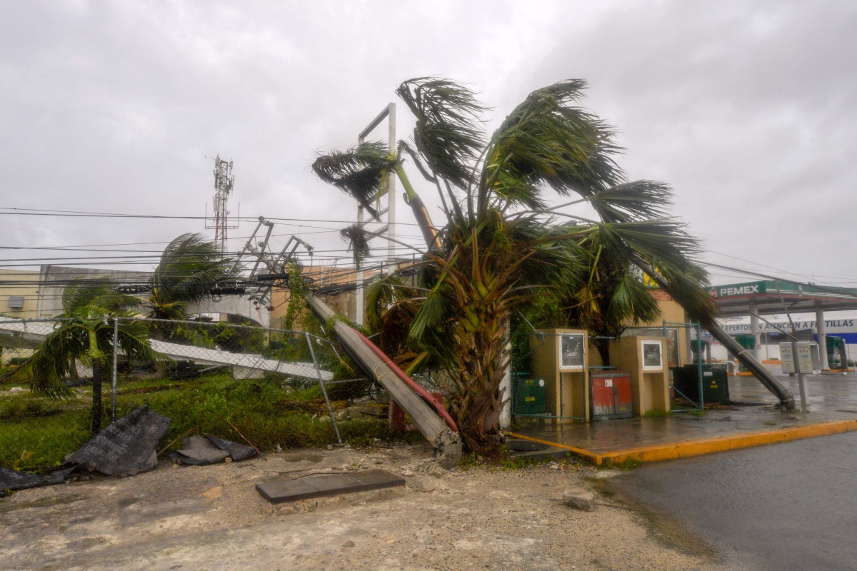 View of fallen power lines and trees after the passage of Hurricane Delta in Cancun, Quintana Roo state, Mexico, on October 7, 2020. Hurricane Delta slammed into Mexico's Caribbean coast early Wednesday, toppling trees, ripping down power lines and lashin