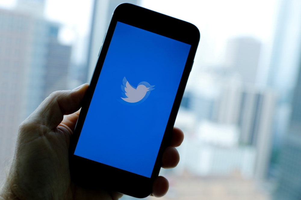 The Twitter App loads on an iPhone in this illustration photograph taken in Los Angeles, California, U.S., July 22, 2019. REUTERS/Mike Blake/File Photo