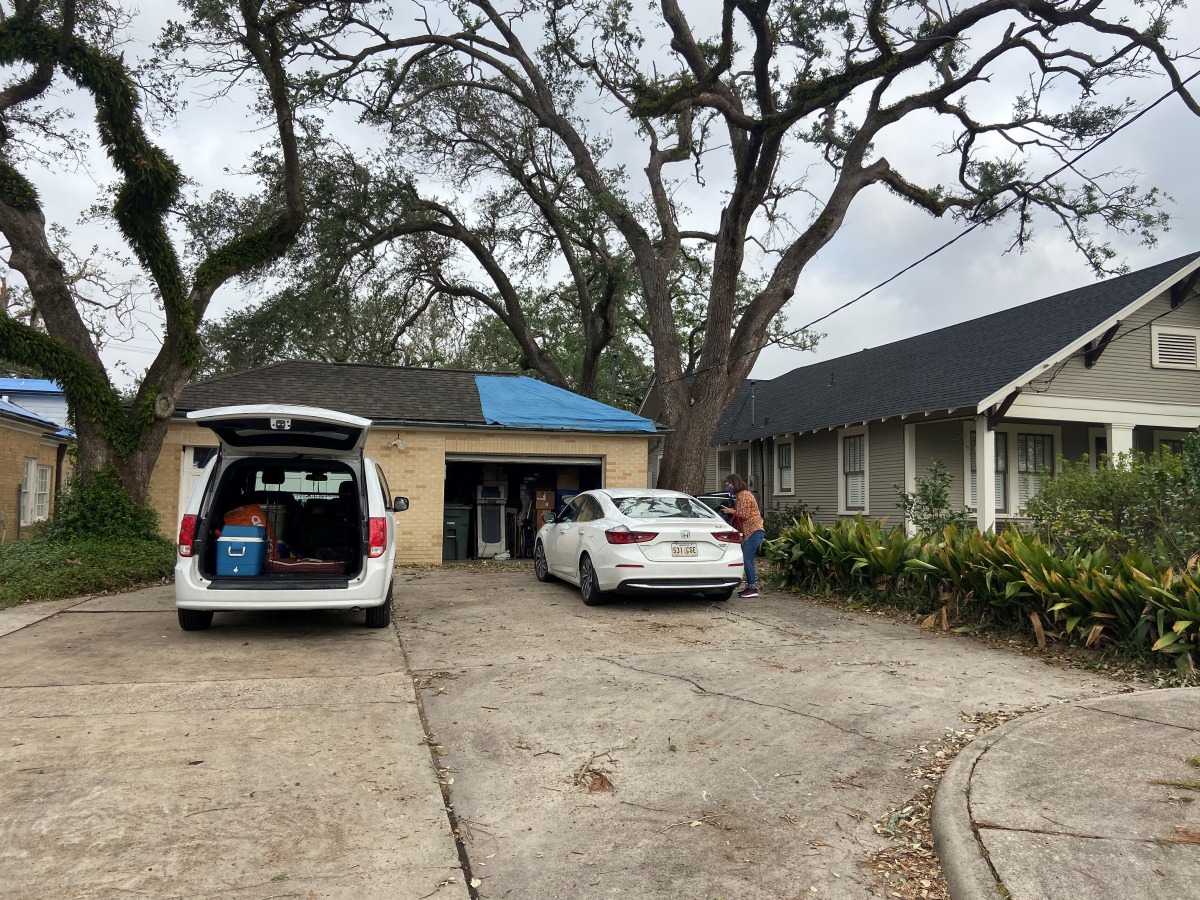 Carmel Fazzio unloads her car after returning home following Hurricane delta in Lake Charles, Louisiana, U.S. October 11, 2020. REUTERS/Stephanie Kelly
