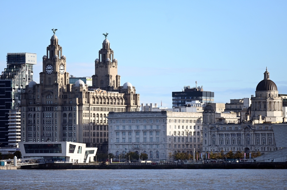 Buildings in Liverpool, including the Liver Building, are pictured across the River Mersey, from Birkenhead, north west England on October 13, 2020.  AFP / Paul ELLIS