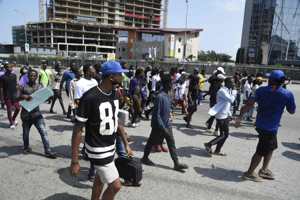 Demonstrator march at the Lekki toll Plaza to protest against abuses by the Special Anti-Robbery Squad in Lagos, on October 12, 2020.  AFP / PIUS UTOMI EKPEI
