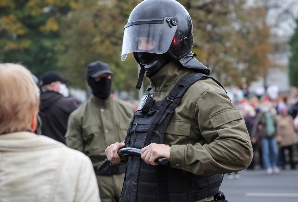 Law enforcement officers block opposition supporters, mostly pensioners, during a rally to reject the presidential election results in Minsk, Belarus October 12, 2020. REUTERS/Stringer