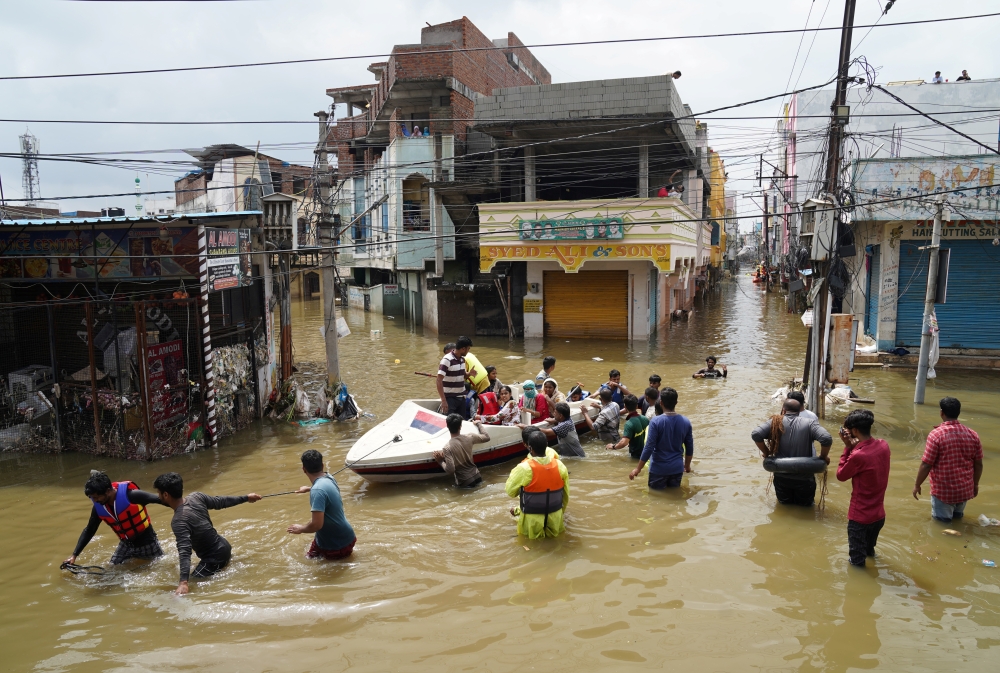 Residents are evacuated from a flooded neighbourhood after heavy rainfall in Hyderabad, the capital of the southern state of Telangana, India, October 15, 2020. REUTERS/Vinod Babu