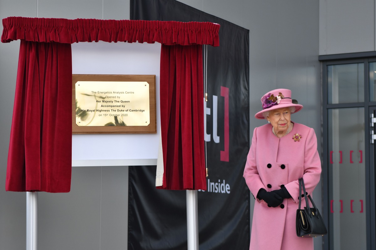 Britain's Queen Elizabeth II (R) is seen after she unveiled a plaque to officially open the new Energetics Analysis Centre at the Defence Science and Technology Laboratory (Dstl) at Porton Down science park near Salisbury, southern England, on October 15,