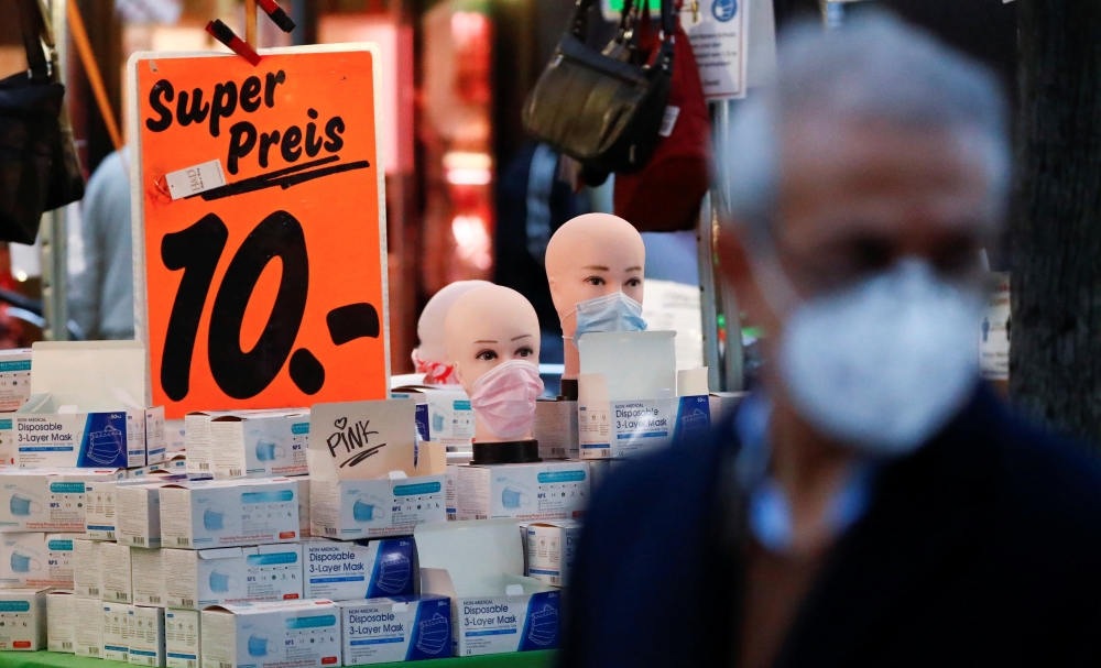 Face masks are on sale at Wilmersdorfer Strasse shopping street, as the coronavirus disease (COVID-19) outbreak continues, in Berlin, Germany, October 26, 2020. REUTERS/Fabrizio Bensch