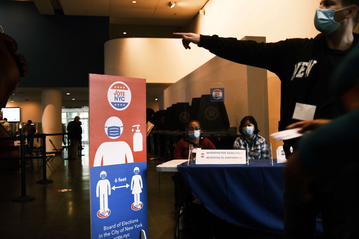 NEW YORK, NEW YORK - OCTOBER 28: People vote at the Brooklyn Museum during early voting on October 28, 2020 in New York City. Election officials are trying to ensure that the voting process is both safe and efficient due to the coronavirus (COVID-19) pand