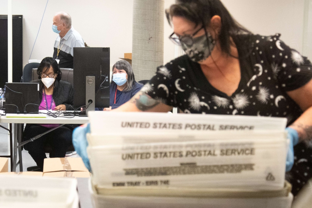 Ballots are counted by Maricopa County Elections Department staff ahead of Tuesdays election on October 31, 2020 in Phoenix, Arizona. Early voting lasted from October 7th through the 30th in Arizona, which had a record number of early voters. Courtney Ped
