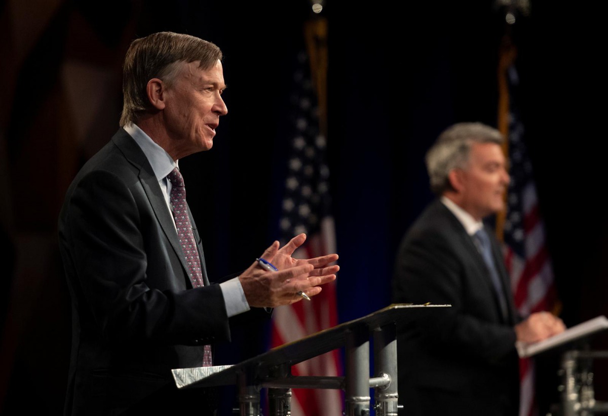 Republican U.S. Sen. Cory Gardner participates with Democratic challenger and former Colorado Gov. John Hickenlooper in the final debate in the 2020 race for Colorado's U.S. Senate seat at Colorado State University in Fort Collins, Colorado, U.S. October 