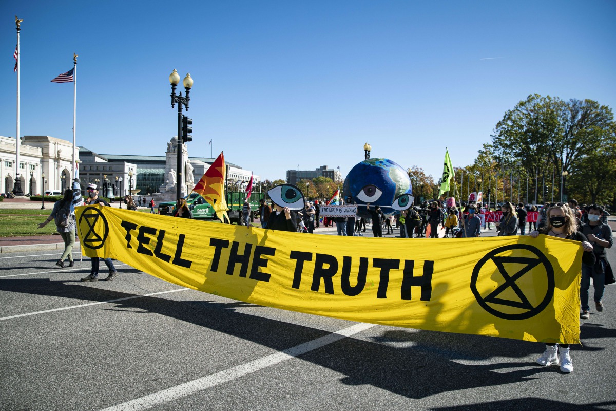 WASHINGTON, DC - NOVEMBER 04: Activists march during a protest from Union Station to the Fox News offices, on November 4, 2020 in Washington DC. Al Drago/Getty Images/AFP

