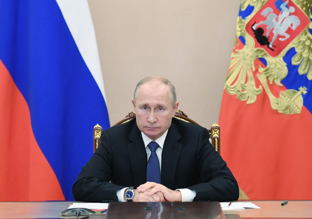 Russian President Vladimir Putin attends a meeting with the members of the Security Council via teleconference call, in Moscow, Russia on November 6, 2020. / AFP / Sputnik / Alexey NIKOLSKY