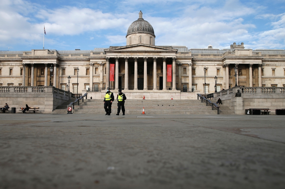 Police officers patrol in Trafalgar square in central London as England enters a second coronavirus lockdown on November 5, 2020. AFP / Hollie Adams