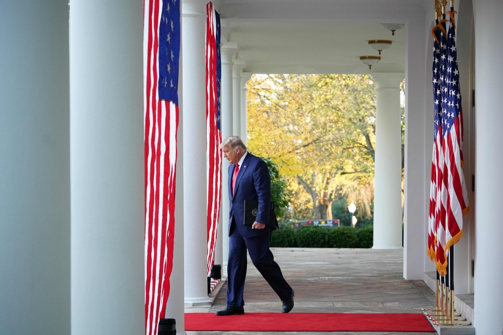 US President Donald Trump arrives to deliver an update on 