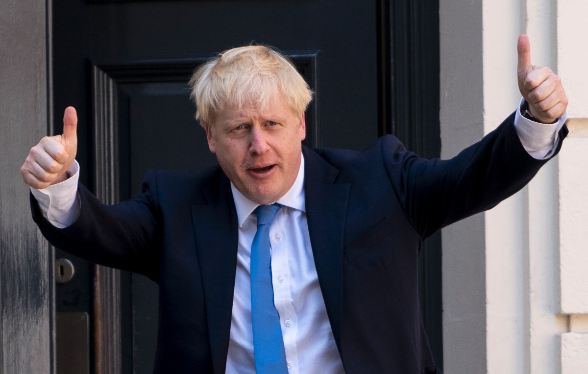 (FILES) In this file photo taken on July 23, 2019 new Conservative Party leader and incoming prime minister Boris Johnson arrives at the Conservative party headquarters in central London. On July 23, 2019, party members choose Brexit figurehead Boris John