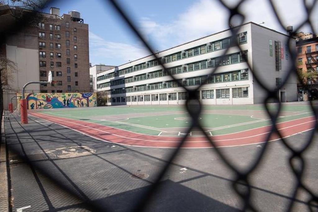 FILE PHOTO: An empty playground is seen at the Anderson School PS 334 during the outbreak of the coronavirus disease (COVID-19) in the Manhattan borough of New York City, New York, U.S., April 12, 2020. REUTERS/Jeenah Moon
