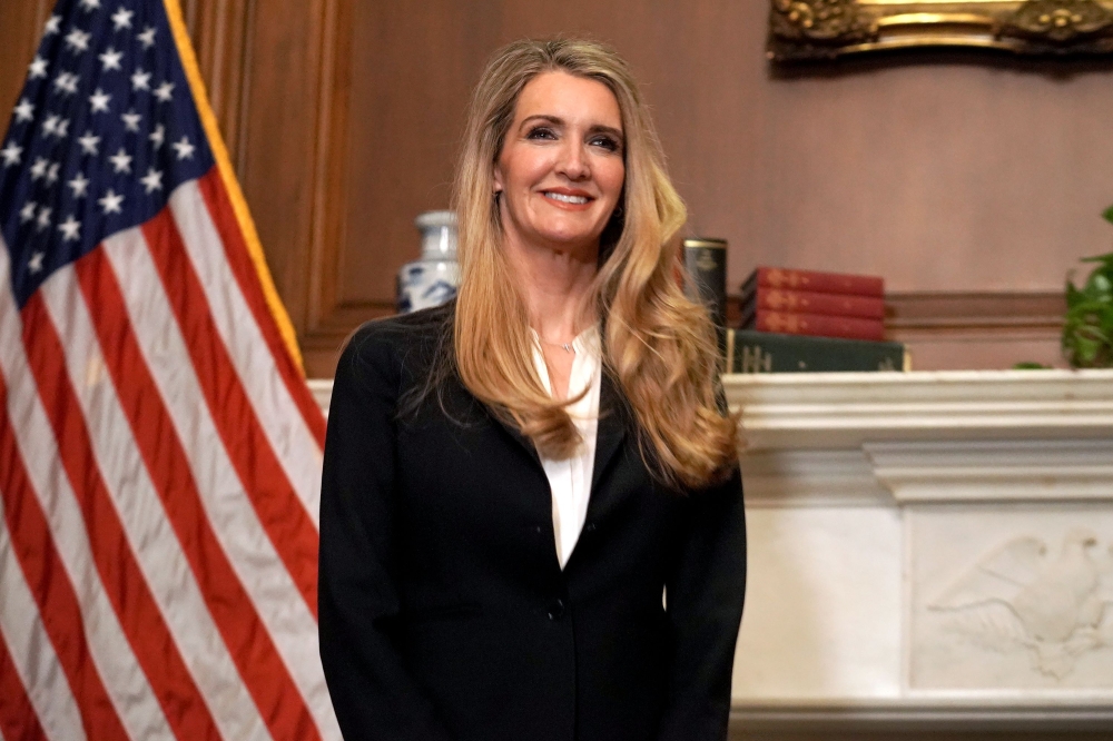 In this file photo taken on September 30, 2020 Republican Senator from Georgia Kelly Loeffler smiles as she meets with US Supreme Court nominee Amy Coney Barrett (off frame) at the US Capitol in Washington, DC. A US Republican senator contesting a closely
