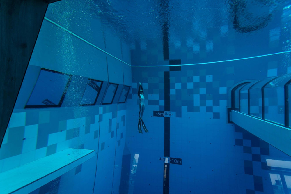 A diver is seen in the deepest pool in the world with 45.5-metre (150-foot) located in Mszczonow about 50 km from Warsaw, November 21, 2020. AFP / Wojtek Radwanski 