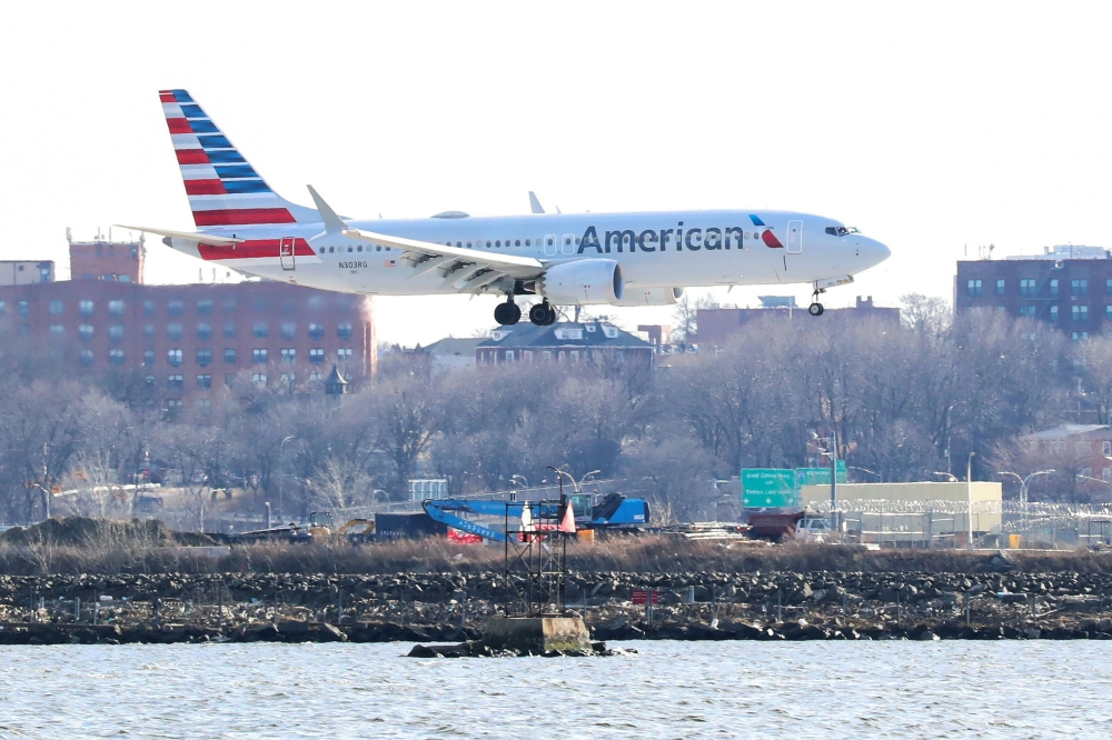 An American Airlines Boeing 737 MAX 8, on a flight from Miami to New York City, comes in for landing at LaGuardia Airport in New York, U.S., March 12, 2019. REUTERS/Shannon Stapleton/File Photo