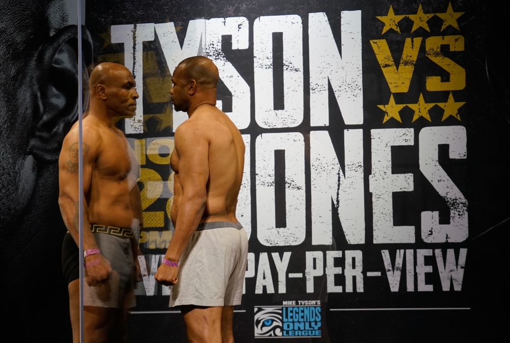 Mike Tyson and Roy Jones, Jr. during weigh ins for a heavyweight exhibition boxing bout for the WBC Frontline Belt in Los Angeles. Lynn Millspaugh