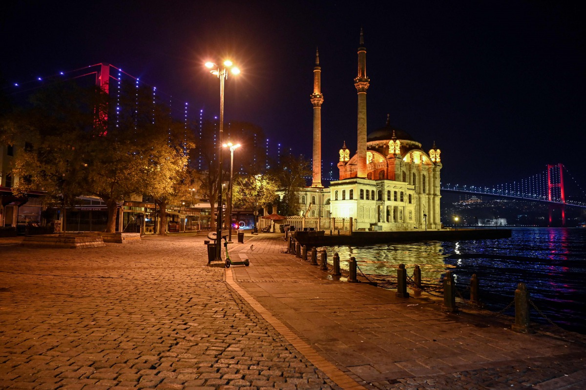 General view of the deserted Ortakoy square, during a night-time curfew aimed at curbing the spread of the Covid-19 pandemic caused by the novel coronavirus, in Istanbul, on November 28, 2020. A partial curfew from 8pm to 10am started in Turkey on Novembe