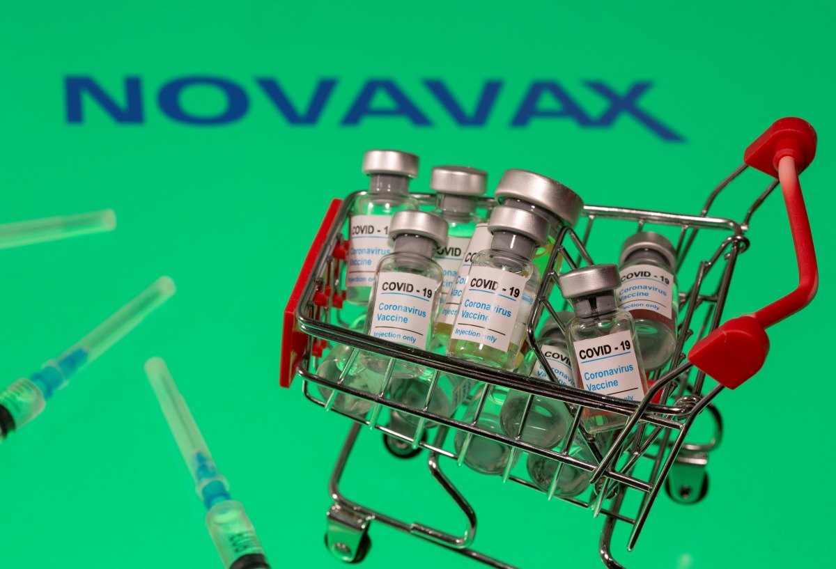 A small shopping basket filled with vials labeled 
