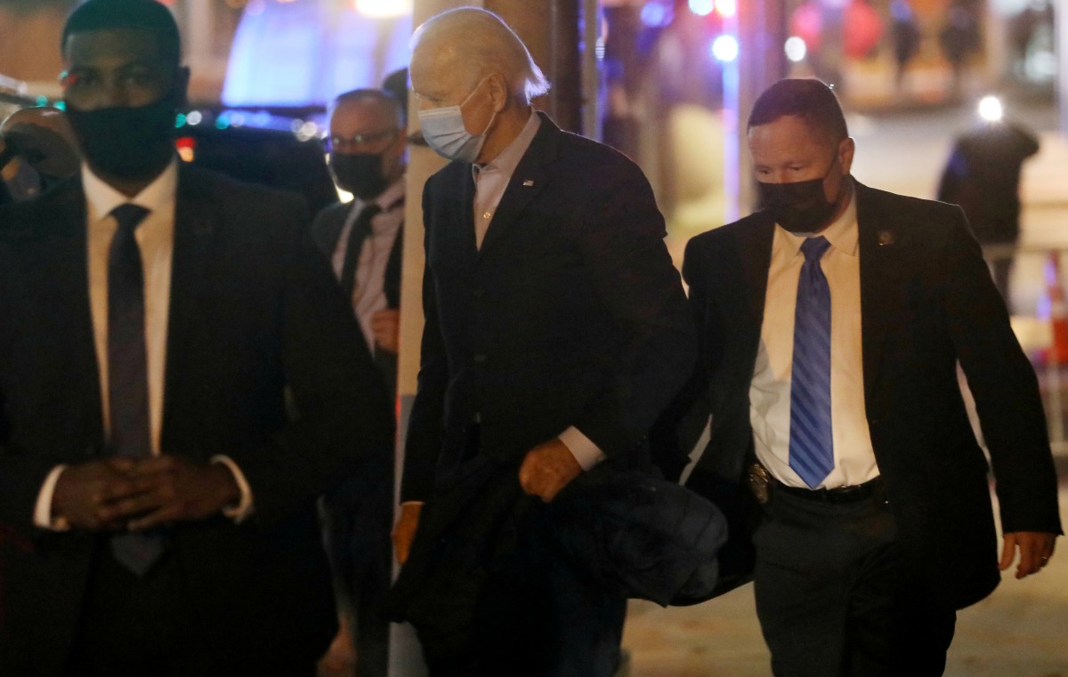 U.S. President-elect Joe Biden gets in his car as he leaves The Queen theater after having a video call with small business owners and workers impacted by the current economic crisis in Wilmington, Delaware, U.S., December 2, 2020. REUTERS/Leah Millis
