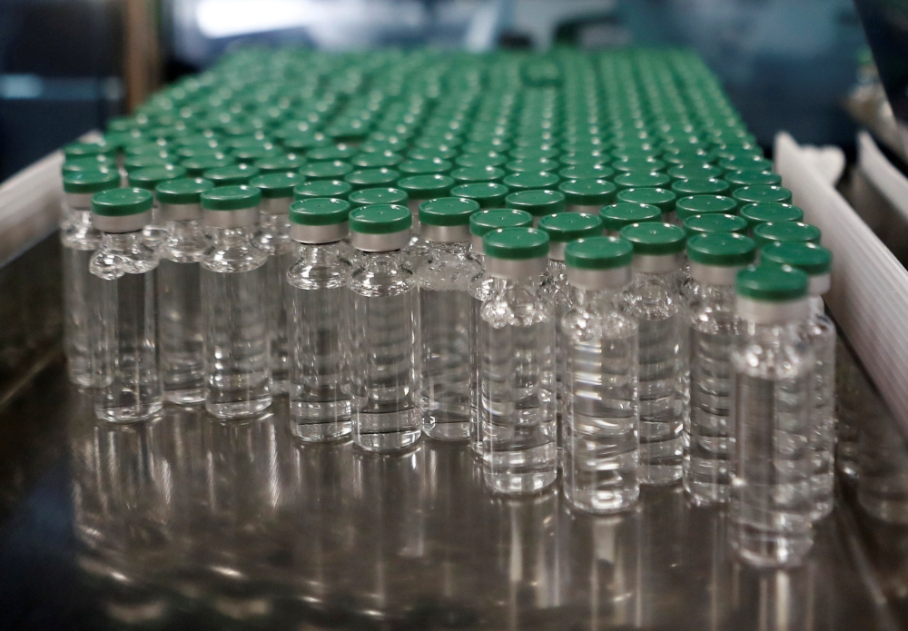 Vials of AstraZeneca's COVISHIELD, coronavirus disease (COVID-19) vaccine are seen before they are packaged inside a lab at Serum Institute of India, in Pune, India, November 30, 2020. Picture taken November 30, 2020. REUTERS/Francis Mascarenhas