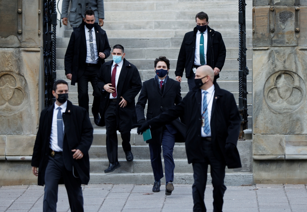 Canada's Prime Minister Justin Trudeau walks to a news conference, as efforts continue to help slow the spread of the coronavirus disease (COVID-19), in Ottawa, Ontario, Canada December 7, 2020. REUTERS/Blair Gable
