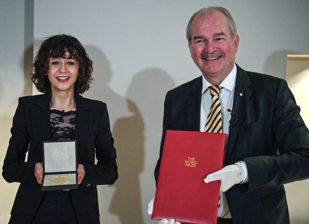 French scientist Emmanuelle Charpentier, director of the Max Planck Institute for Infection Biology in Berlin, 2020 Nobel Prize winner in Chemistry for the development of a method for genome editing, poses after receiving her Nobel diploma and medal from 