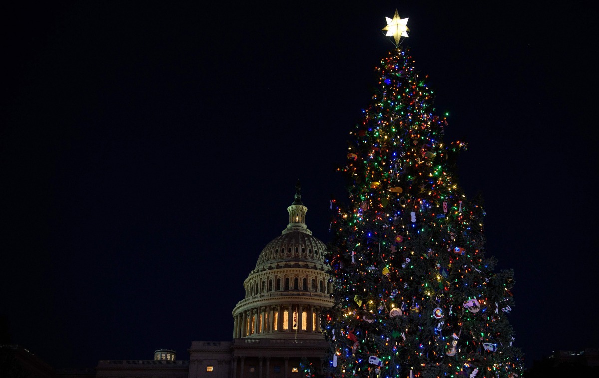 (FILES) In this file photo taken on December 02, 2020 the Capitol Christmas Tree is lit in front of the US Capitol in Washington, DC. Top US lawmakers scrambled December 6, 2020 to reach difficult agreements as quickly as possible on a new aid package for