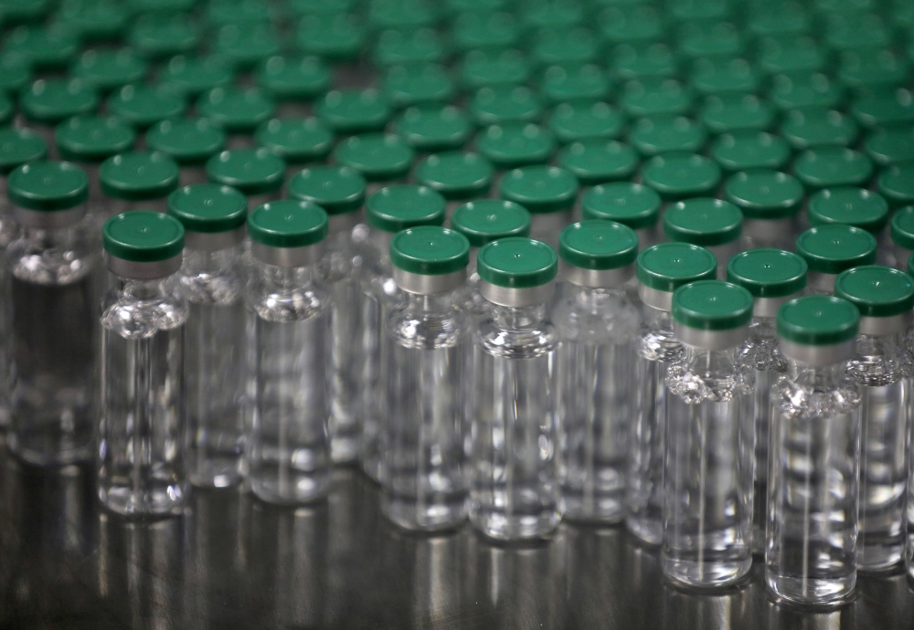 Vials of AstraZeneca's COVISHIELD, coronavirus disease (COVID-19) vaccine, are seen before they are packaged inside a lab at Serum Institute of India, Pune, India, November 30, 2020. REUTERS/Francis Mascarenhas/File Photo